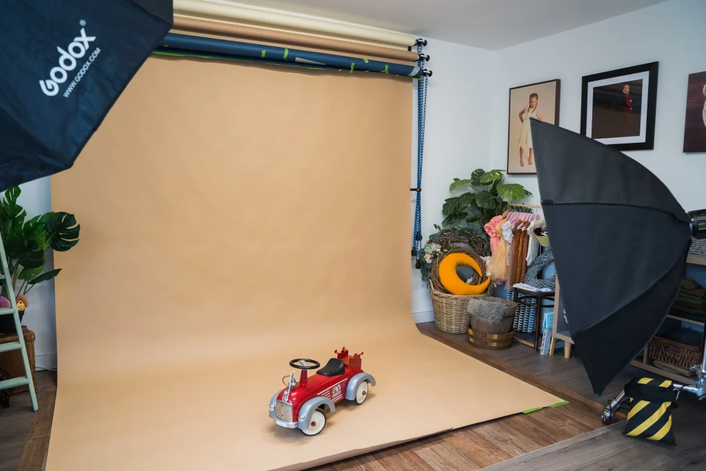 Little toy tuck on background paper in photography studio